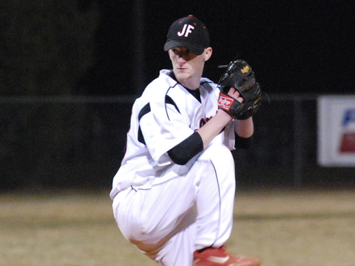 Pitcher from the balance point getting ready to deliver a pitch